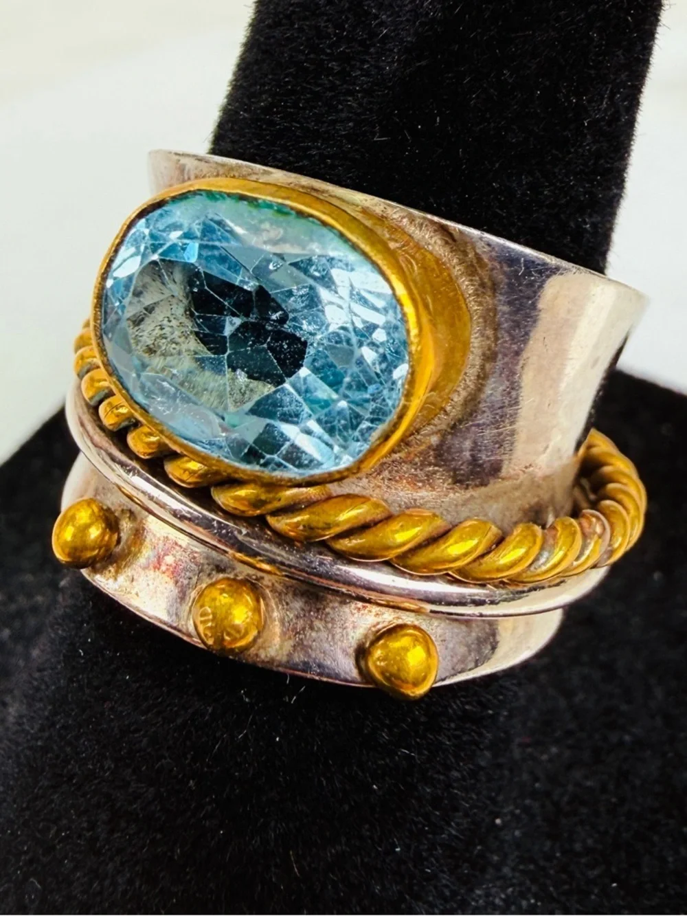 Beautiful size 5 1/2 Silvertone and bronze stamped 925 blue topaz, spinner ring